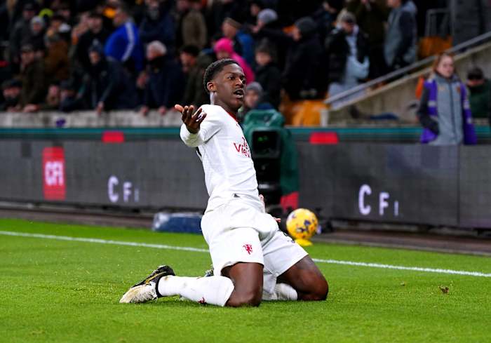 Kobbie Mainoo pictured celebrating after scoring the first goal of his Premier League career to seal a 4-3 win for Manchester United at Wolves in February 2024
